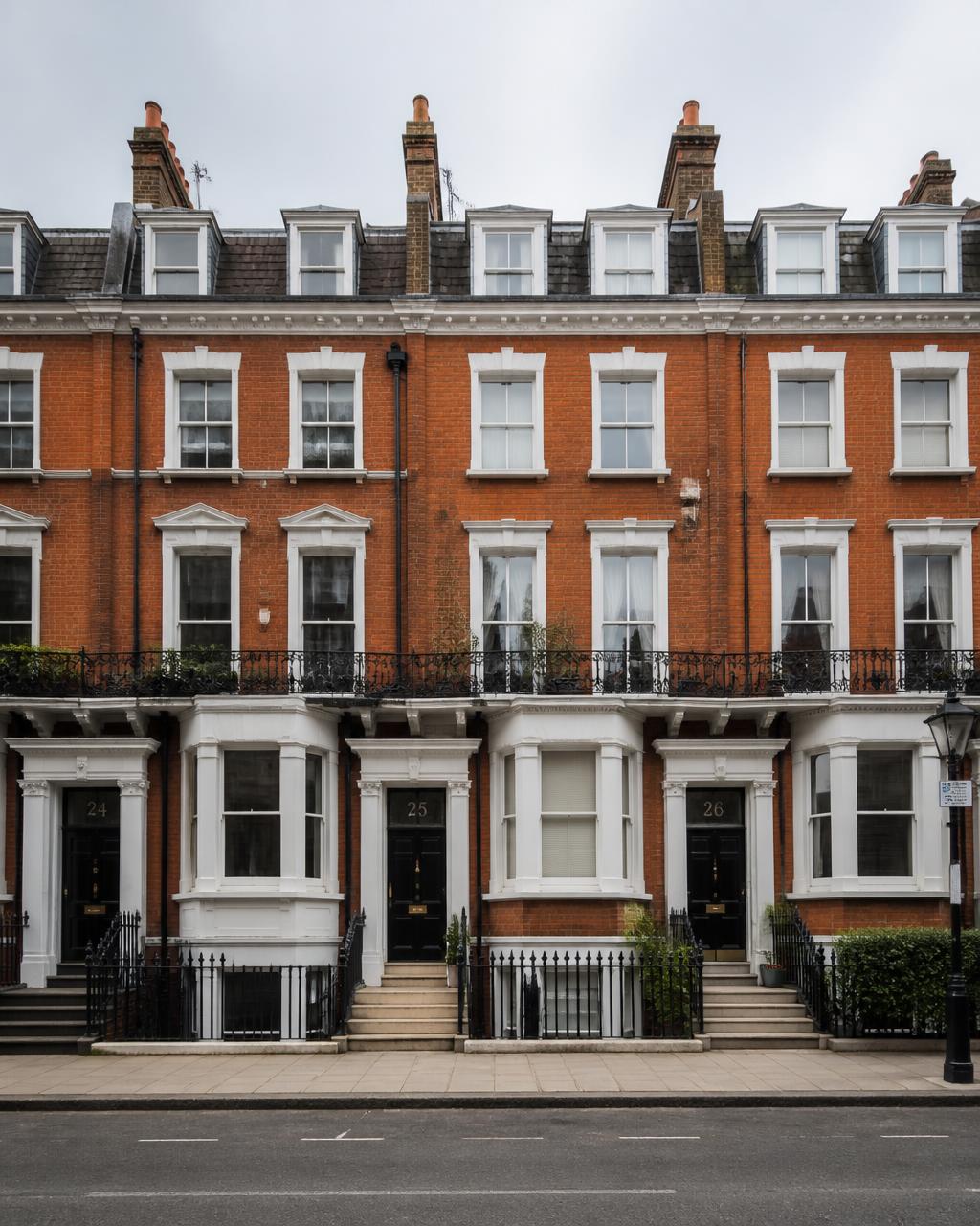 Row of classic UK red-brick townhouses